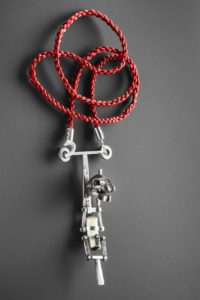 Elizabeth Shaw, Braced figure, Recycled and reused sterling silver, found ceramic, dolls hair, 8 x 2.5 x 3 cm pendant, 2015, made in Brisbane, photo: Michelle Bowden