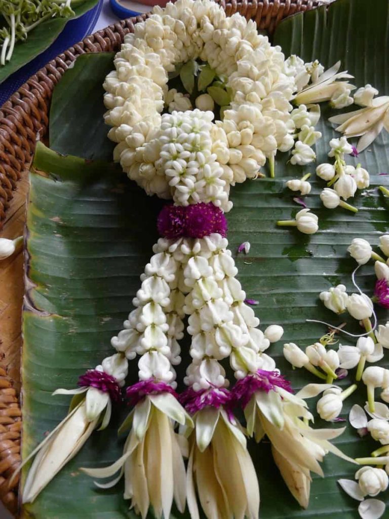 First traditional Phuang Malai I made using Jasmine, Crown flowers, Amaranth and Magnolia flowers. Together the crown flower and amaranth mean never ending love. Pak Kret, Thailand, 2014. Photo: Jess Dare.